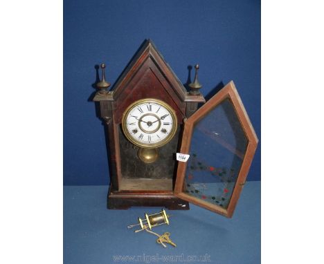 A Jerome wooden cased and glass fronted eight day mantle Clock with key, 19'' tall x 10'' wide at base