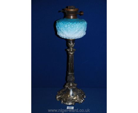A plated Oil Lamp with ombre blue glass oil reservoir on Corinthian column base decorated with acanthus leaves, 22'' tall.