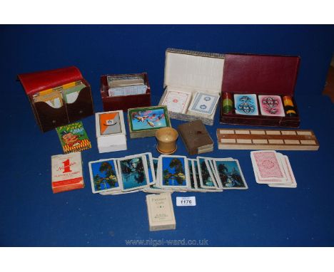 A quantity of various playing cards including boxed set with gaming counters, crib board etc.