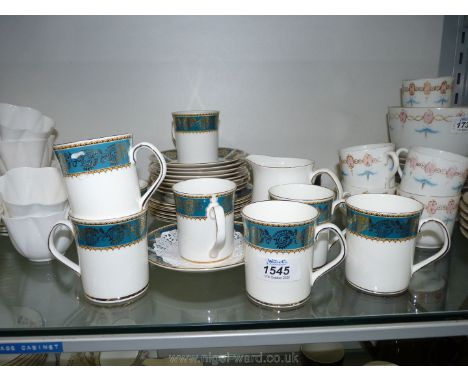 An Elizabethan "Lucerne" part Teaset, white ground with turquoise and gold border to include; six cups and saucers, side plat