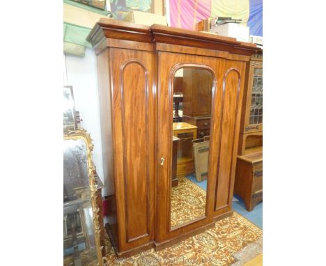 A Victorian Mahogany break front Wardrobe having unusual internal arrangement with a flight of three long drawers with linen 