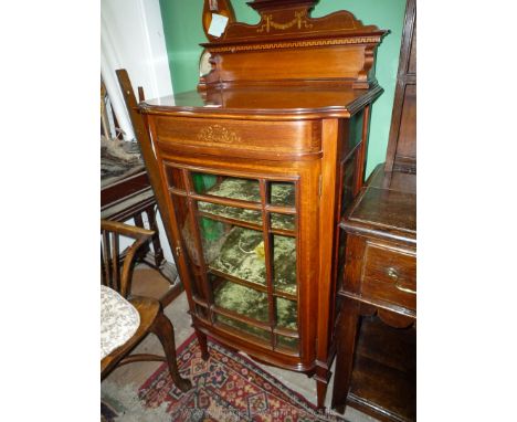 A lovely circa 1900 Mahogany bow fronted china Display Cabinet having a nine pane glazed door revealing a crushed green velve