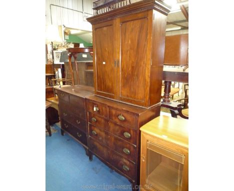 A 19th c. Mahogany enclosed Bookcase on Chest, the base with three long and two short drawers with oval brass back-plate drop