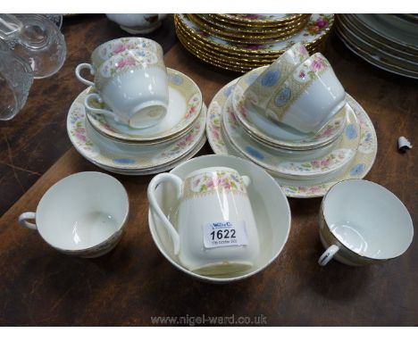 A Heathcote part Teaset including six cups, saucers and tea plates, milk jug and sugar bowl and bread/butter plate, white gro