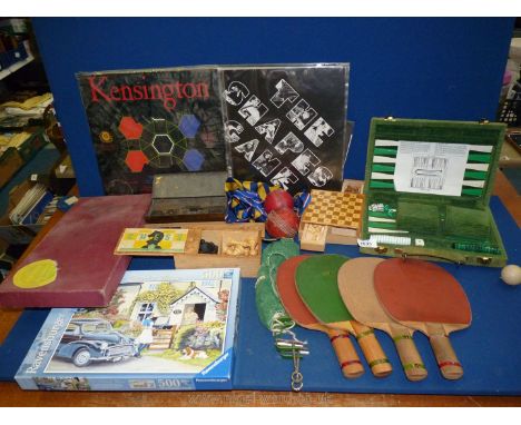 A boxed green covered Backgammon game, a new 500 piece jigsaw, Scrabble, a small wooden Chess set, etc.