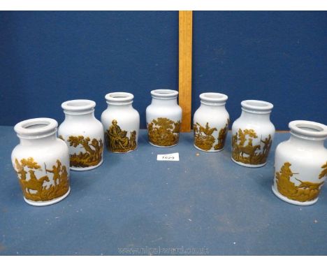 Seven blue and gold transfer print ceramic pots;  hunting scenes, horses, dog and Shakespeare, 4" tall.