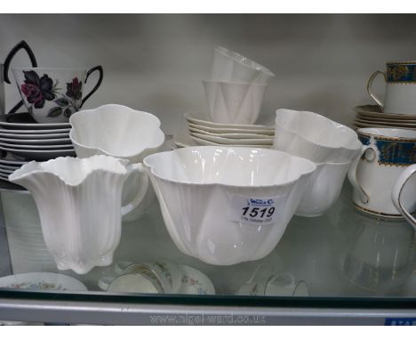 A part Shelley Teaset in white including five saucers, six cups, six tea plates, plus another small Shelley plate.