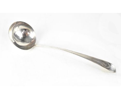 A large Georgian Irish hallmarked silver ladle by John Pittar, Dublin, the long handle with an repeating trellis edge border 