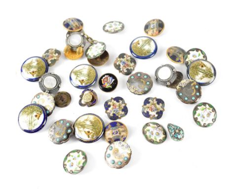 A collection of vintage ceramic and white metal gilt-heightened and enamelled buttons.