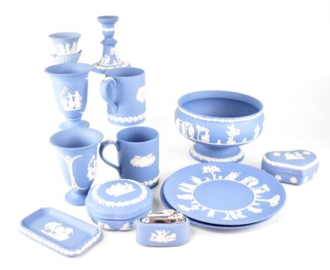 A quantity of Wedgwood light blue jasperware to include a covered cheese dish, a footed bowl, plates, lamp, mug, vases, cover