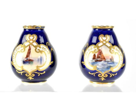 A pair of Royal Crown Derby miniature vases hand painted with sailing boats by W Dean, signed, within gilt beaded cartouches 