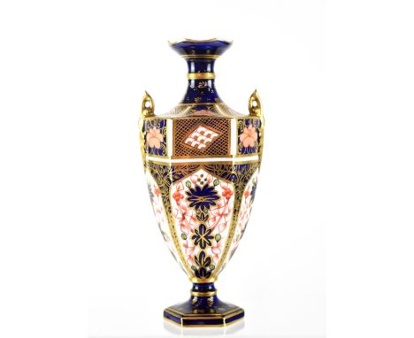 A Royal Crown Derby Imari twin-handled vase of hexagonal form, numbered 1128 1548, printed mark dated 1908, height 17.5cm.