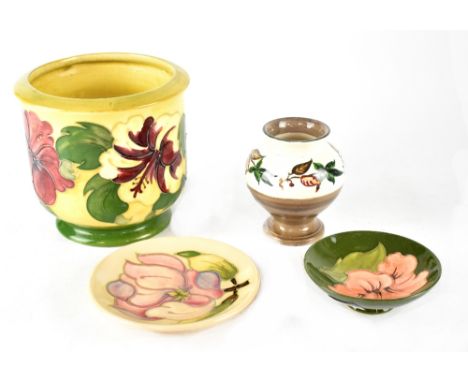 A Moorcroft Pottery planter decorated in the 'Hibiscus' pattern on a yellow ground, impressed marks and green signature for W