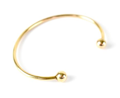 A 9ct gold torque bangle, hallmarked, width 6.5cm, approx 3.8g. CONDITION REPORT In good shape no flat points of creases.