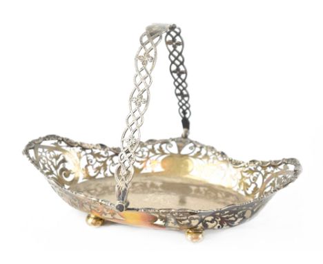 An Edwardian hallmarked silver basket of oval form, with pierced foliate and heart motifs and embossed C-scroll and floral bo