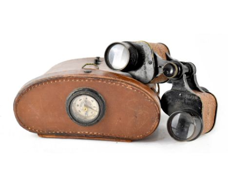 A pair of Bausch &amp; Lomb WWI US Army Signal Corps binoculars in their original brown leather case, with integral compass.