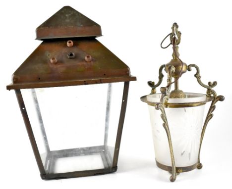 An early 20th century brass outdoor light shade, a brass frame and canopy holding four glass panels, formerly from a railway 