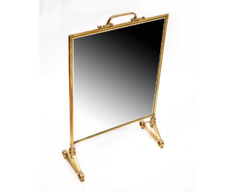 A 19th century style brass-framed fire screen inset with a rectangular bevelled and star decorated mirror plate, on stile fee