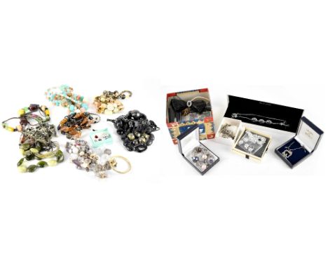 A large quantity of mixed modern costume jewellery to include Swarovski bangle, tree of life necklace, etc.