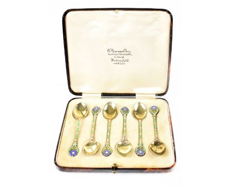 A cased set of George VI hallmarked silver enamelled spoons, the handles decorated with blue forget-me-nots on green and whit