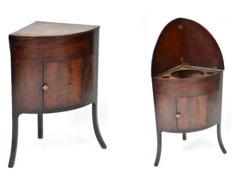 A Victorian mahogany inlaid corner wash stand with hinged top opening to reveal three circular cut-outs above single door, ra