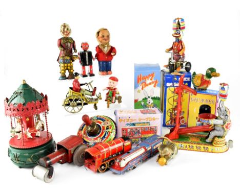 A collection of vintage and modern tinplate toys to include a Chinese dog on a bike, a tractor, a Coronation Express train, a