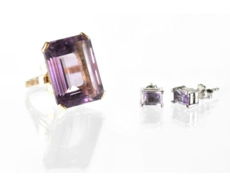 A 9ct gold large amethyst dress ring, size O, also a pair of amethyst and silver earrings (2). CONDITION REPORT The ring is s