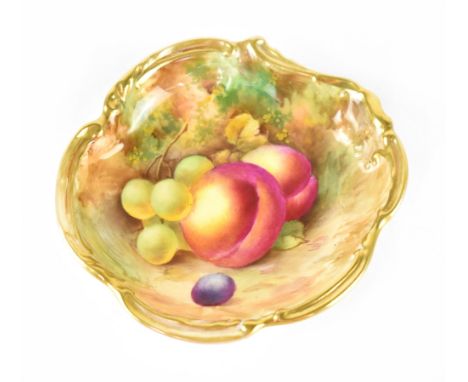 A Royal Worcester pin dish hand painted with fruit within a gilt C-scroll border, puce mark dated 1938, diameter 11.5cm.