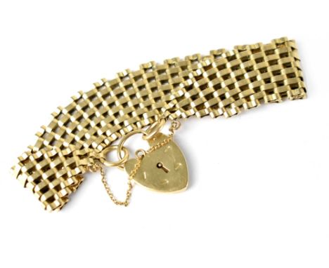 A 9ct gold gate link bracelet with 9ct gold heart clasp, gold safety chain, length 17cm, approx 27g. CONDITION REPORT Both th