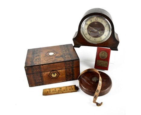 An early Victorian inlaid sewing box with two bands of geometric design centred with a mother of pearl inlaid cartouche and m