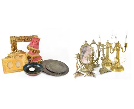 A quantity of decorative items to include a pair of gilt metal twin-branch table lamps, a pair of cast brass candlesticks wit