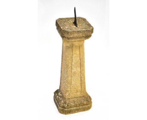 A reconstituted stone garden sundial with gnomon, height approx 97cm.