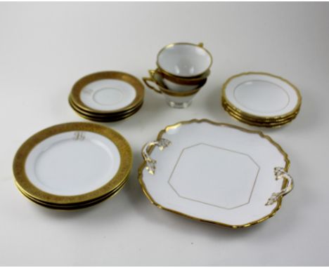 A Czechoslovakian white and gilt-heightened twelve-piece tea service to include cups, saucers, plates, sandwich plate (incomp