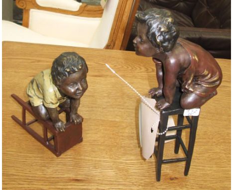 BRONZE, children playing on chairs, two cast bronze style, 20cm H. (2)