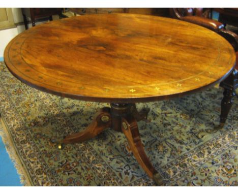 BREAKFAST TABLE, Regency rosewood with brass inlay and decorative mounts,circular tilt top and tripod foot with foliate cast 