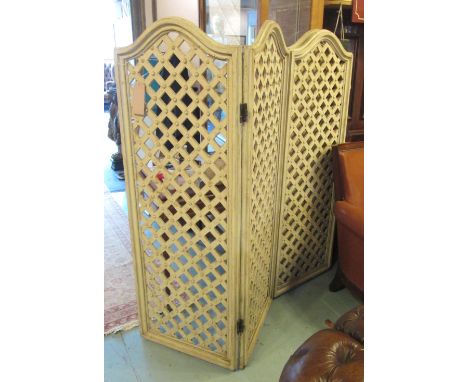 LATTICE SCREEN, circa 1900, French, four fold with arched top in a painted distressed finish, each panel 56cm W x 157cm H. 