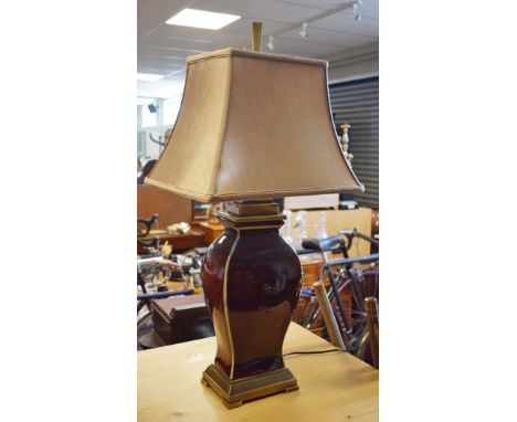 Modern pottery baluster shaped table lamp having sang de boeuf coloured glaze, with shade   Condition: 