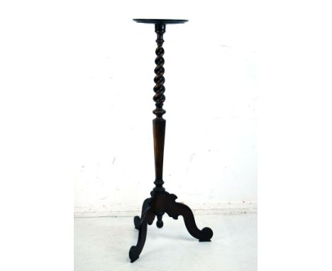 Stained pine and mahogany torchère stand having barley twist and hexagonal column on tripod base   Condition: 