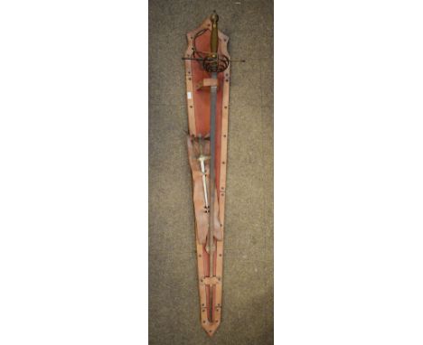 Reproduction dress sword in a leather mounted wall mount and a reproduction dagger, in leather display mount   Condition: 