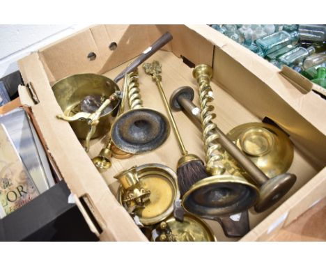 A selection of vintage brass wares including sauce pan, candle stick, poker holder and ash brush