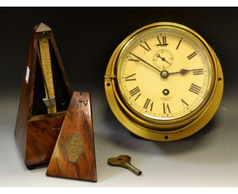 A Smiths Astral brass wall clock, Roman numerals; a walnut cased metronome (2)