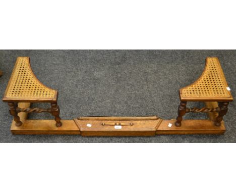 An early 20th Century oak and rattan fender