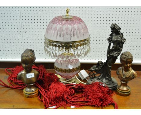 An Art Nouveau spelter figural group of a Lady and her dog; a pair of electroplate busts of a young boy and girl; a table lam