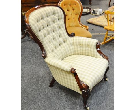 A Victorian mahogany balloon back nursing chair, the buttoned back upholstered in fabric in subtle tones of olive and cream, 
