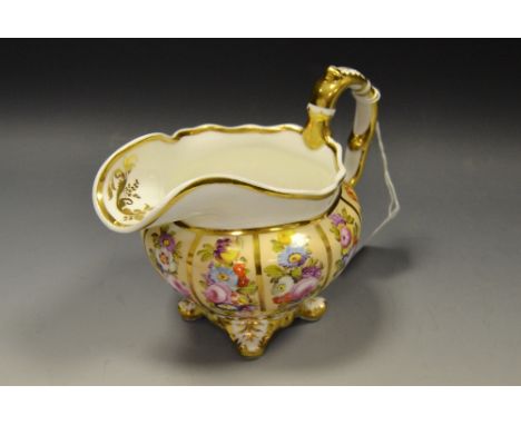 A 19th century Spode Felspar porcelain cream jug, gilded panels, painted with colourful floral bouquets, scroll handle c.1830