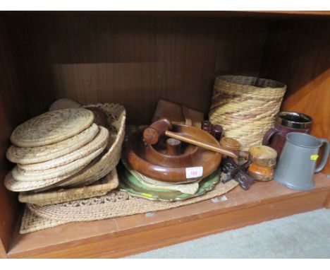 ONE SHELF OF TREEN AND WICKER ITEMS INCLUDING NUT BOWL AND HAMMER, NUT CRACKER, COASTERS, TRAYS. TOGETHER WITH TWO TANKARDS.