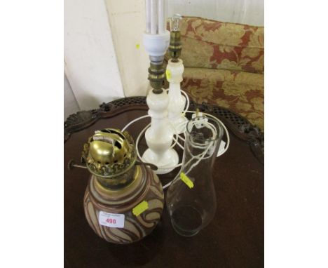 TWO WHITE MARBLE TABLE LAMP BASES, AND A POTTERY OIL LAMP BASE WITH GLASS CHIMNEY .