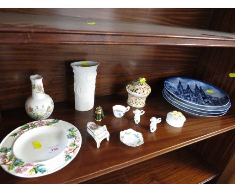 ONE SHELF OF DECORATIVE ITEMS INCLUDING STEM VASE AND FOUR DISPLAY PLATES.