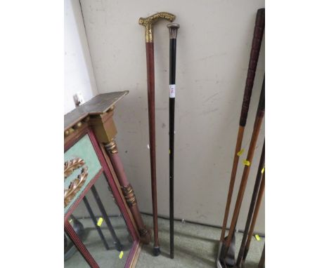 EBONIZED WALKING CANE WITH SILVER CAP, TOGETHER WITH ONE OTHER WALKING STICK WITH BRASS HANDLE