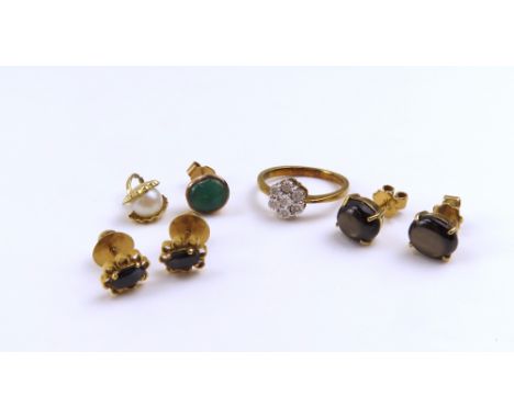 A 9ct gold illusion set cluster ring, finger size N 1/2; a pendant in the form of an oyster shell holding a pearl, acid test 